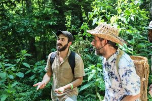 Doug and Todd Elliott on herb walk at 2023 Symposium