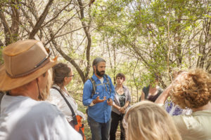 John Slattery teaches bioregional herbalism in the field at the SW Conference